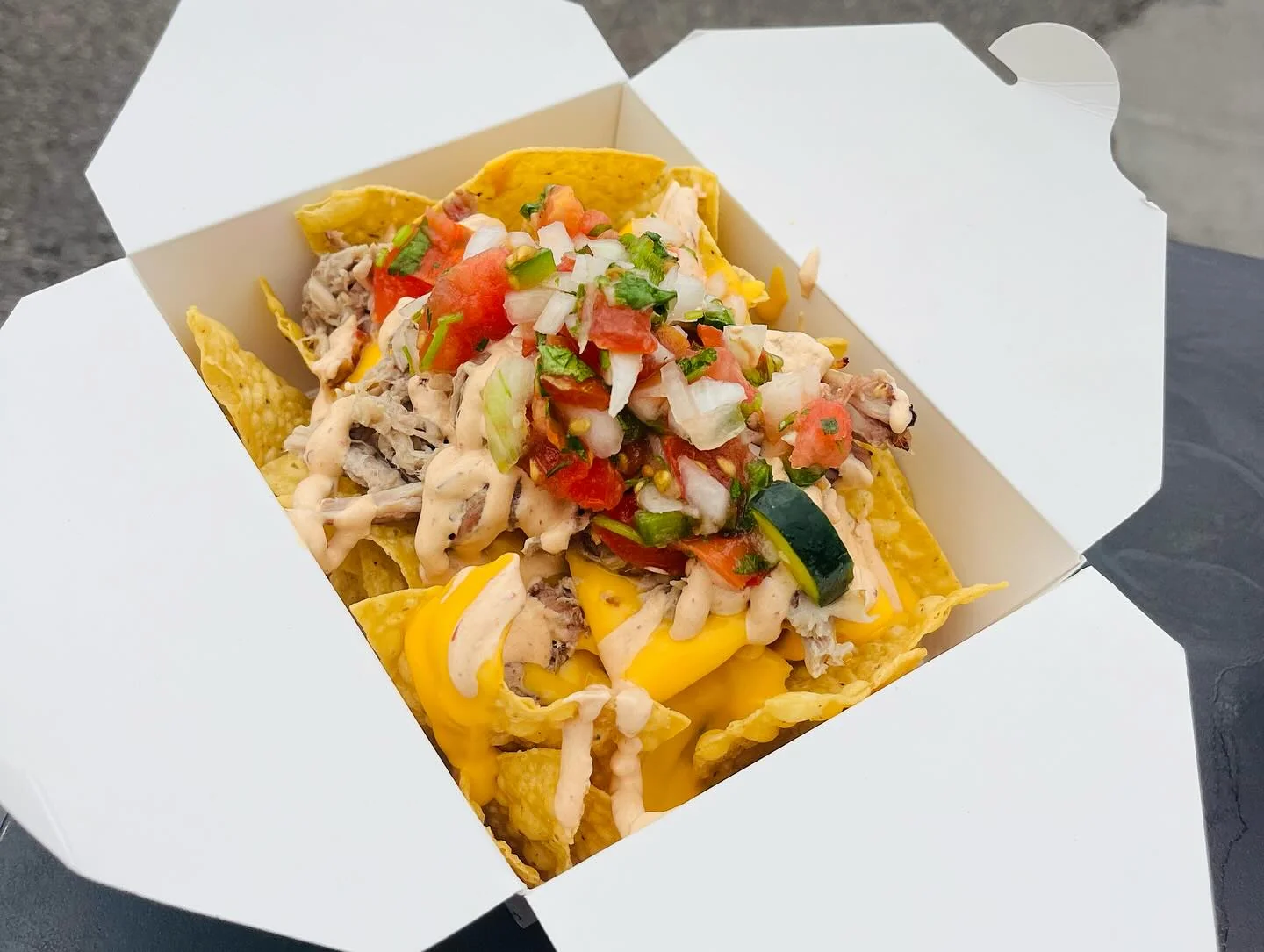 Loaded nachos with pulled pork and pico de gallo
