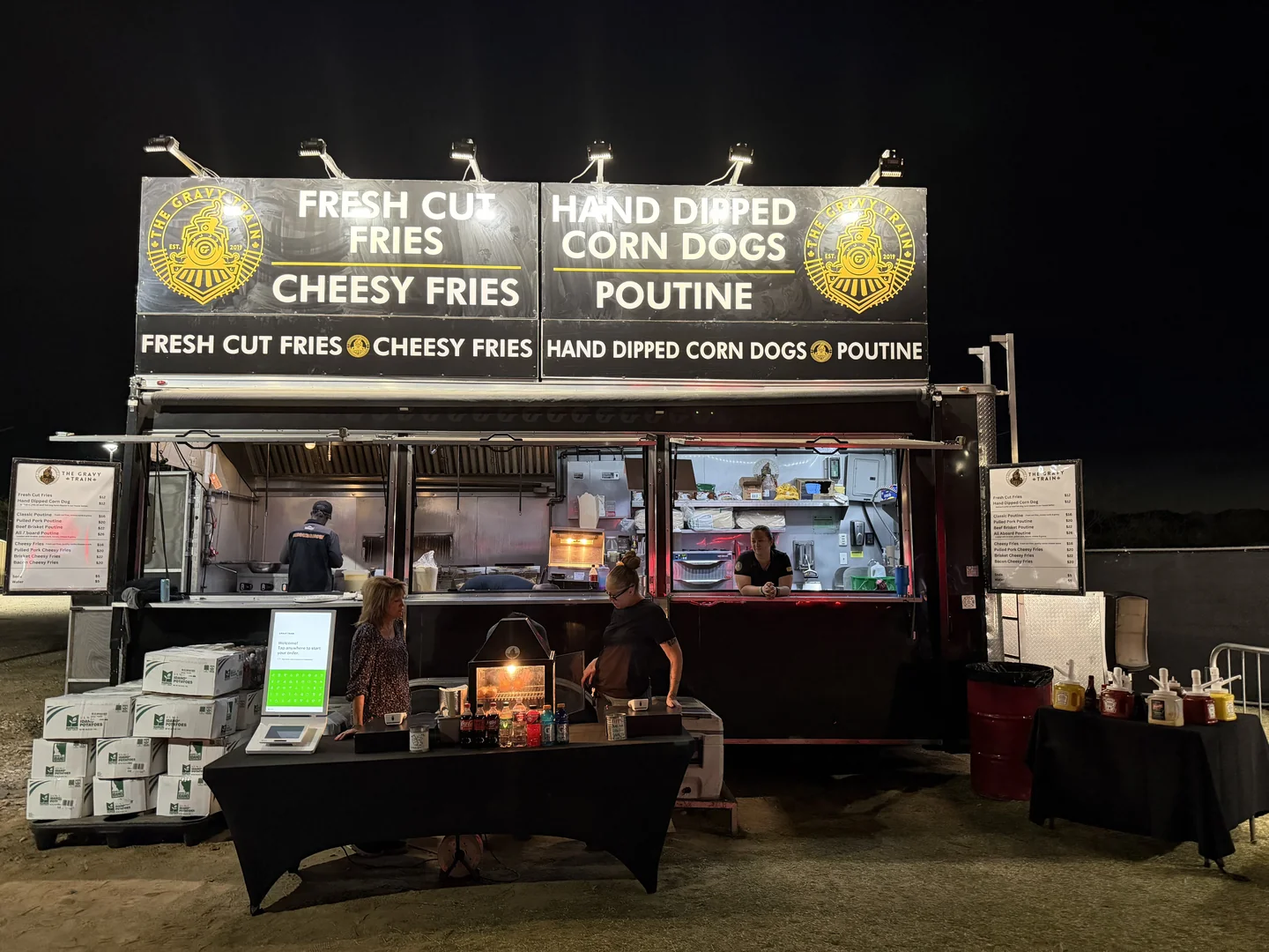 The Gravy Train lit up and serving customers at night