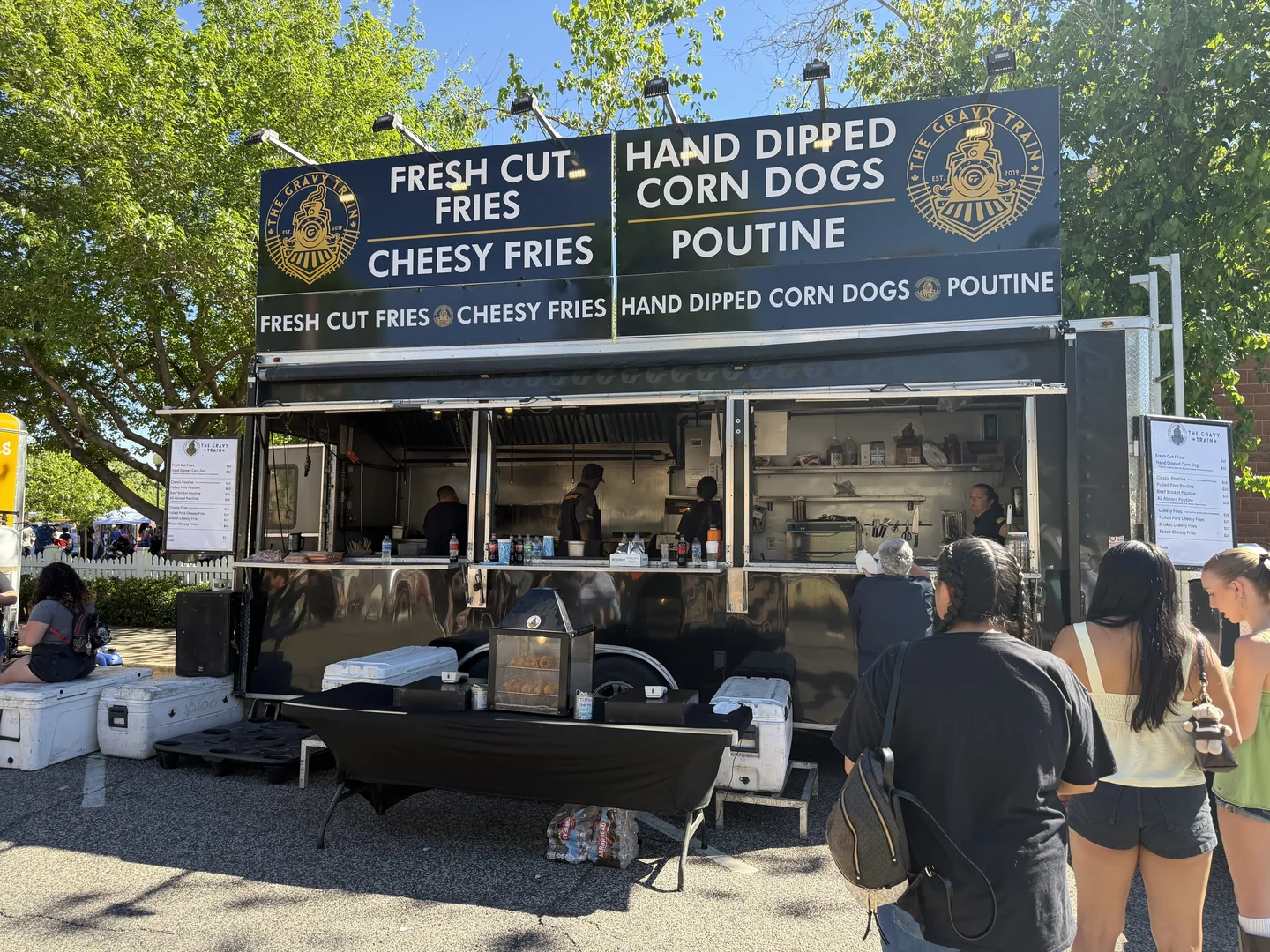 The Gravy Train serving customers on a brick downtown street