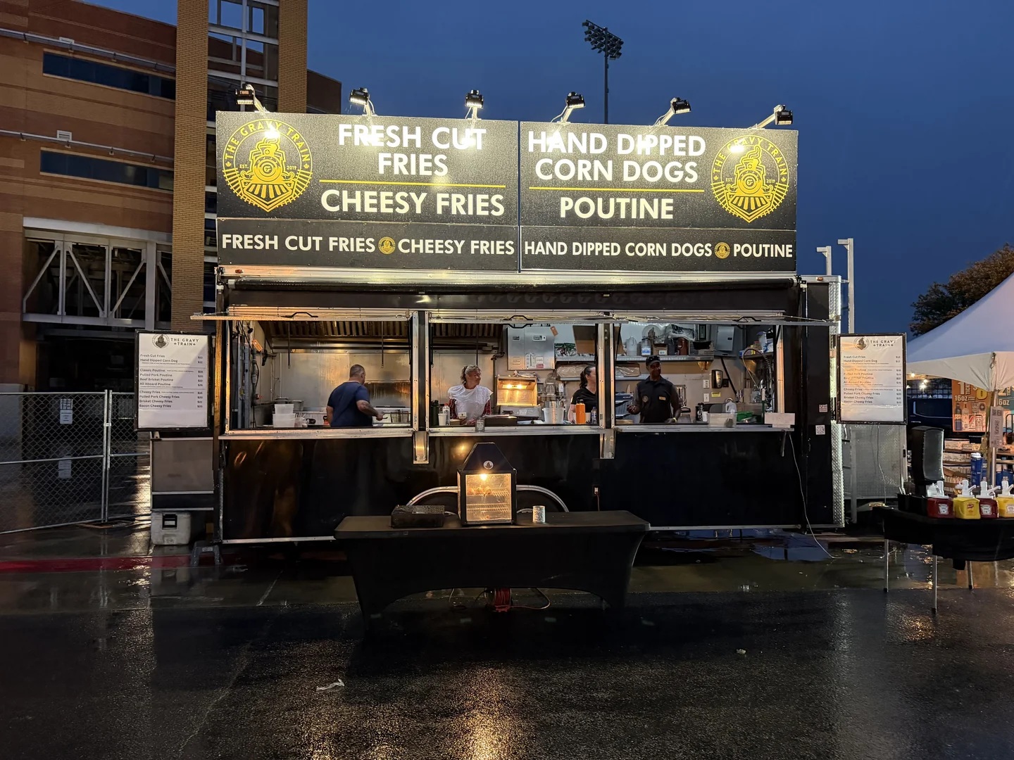 The Gravy Train serving at a stadium event in the rain