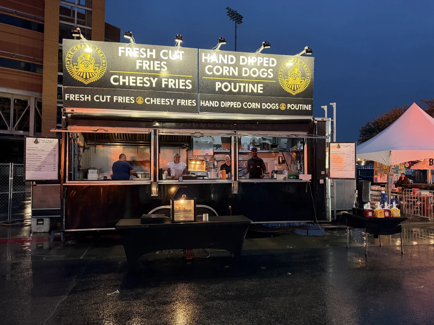The Gravy Train at a rainy stadium event