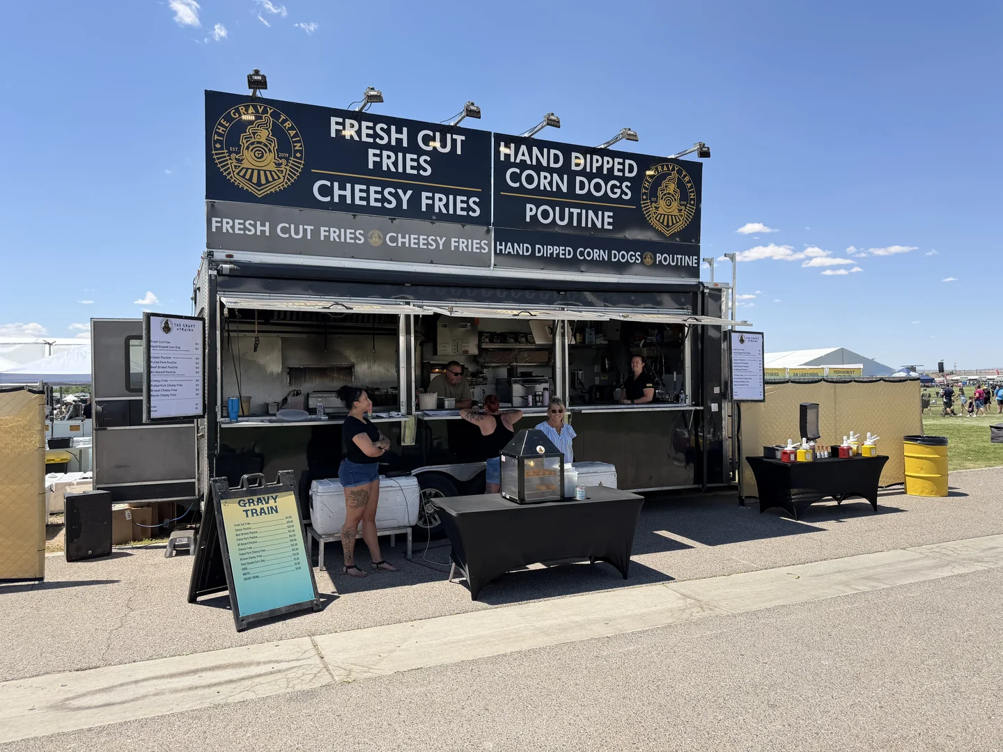 The Gravy Train parked in an open field at an outdoor event