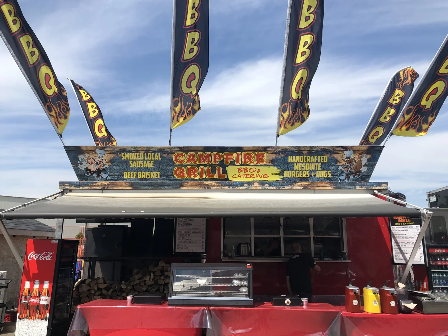 Campfire Grill truck with American flags at a daytime event