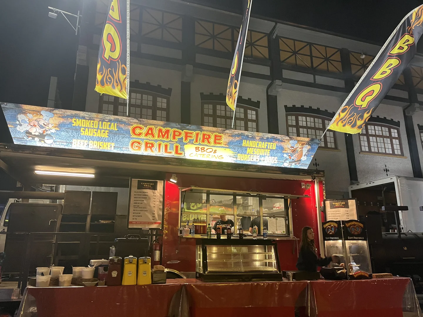 Campfire Grill truck next to a historic building at night