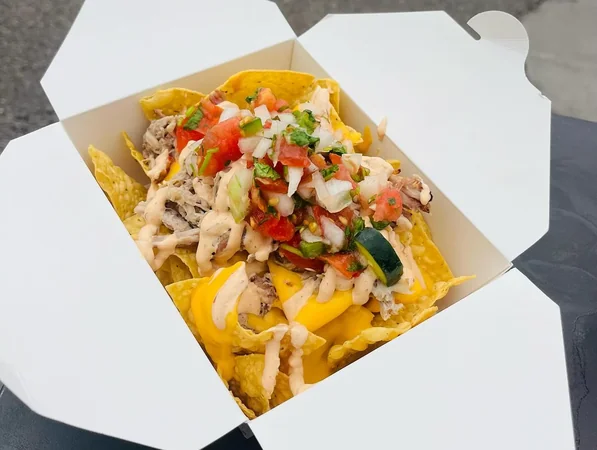 Loaded nachos with pulled pork and pico de gallo